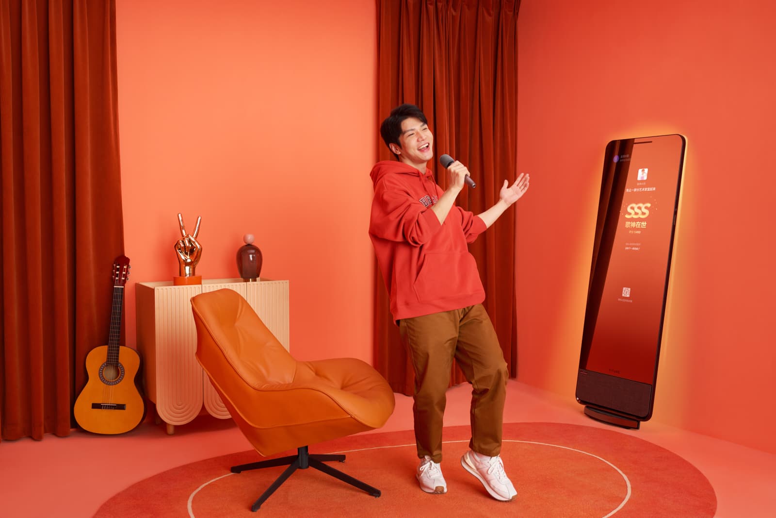 Lifestyle tech campaign with man singing karaoke in styled coral room with smart entertainment display by Una Zhu