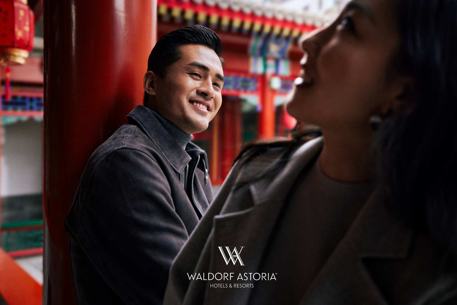 Waldorf Astoria hotel campaign with couple laughing at traditional red pavilion in Beijing by Una Zhu