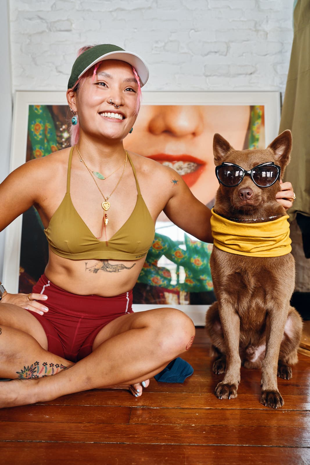 Oakley editorial portrait with model and dog wearing sunglasses in creative studio setting by Una Zhu