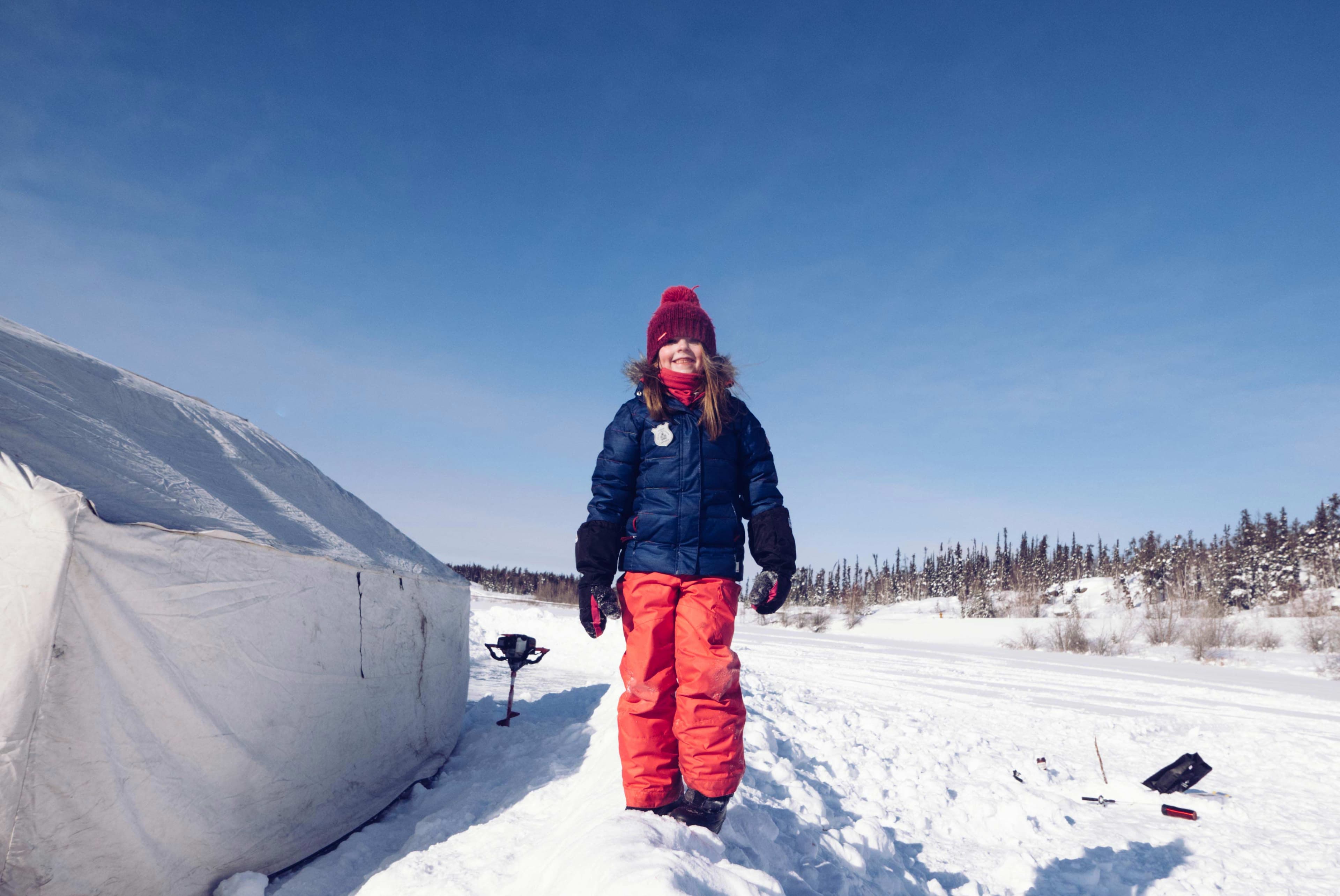 Kids outdoor clothing advertising with child in winter apparel on snowy landscape by Una Zhu