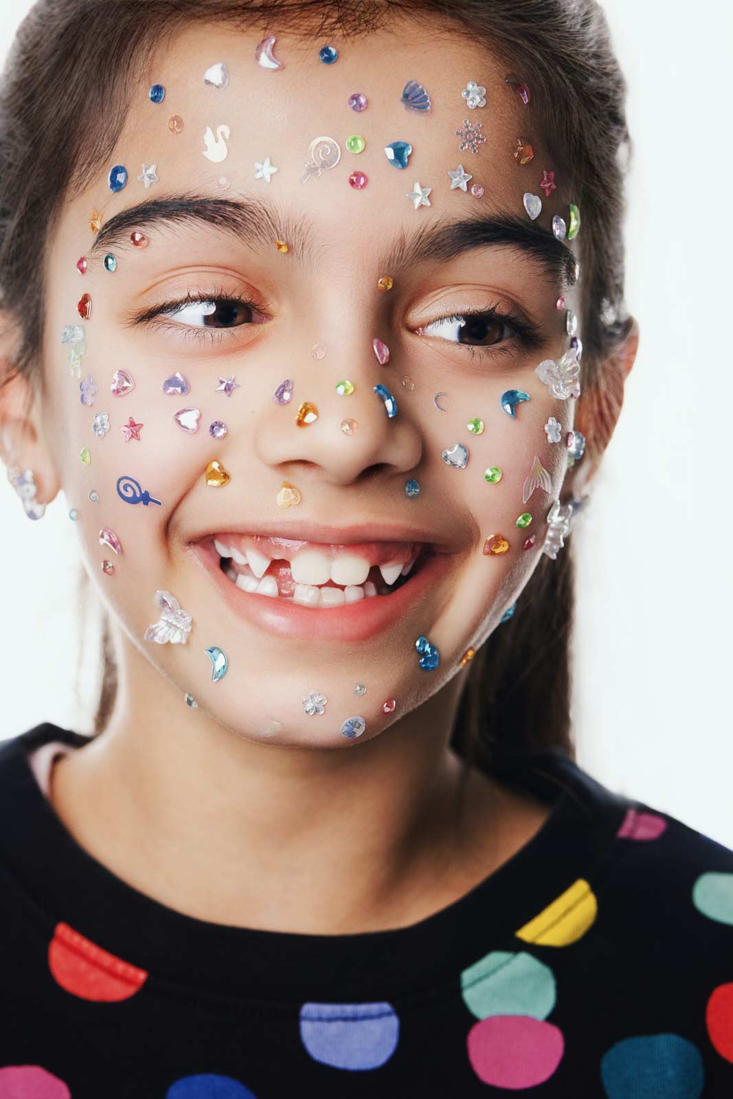 Editorial kids commercial close-up portrait with gem accessories by Una Zhu