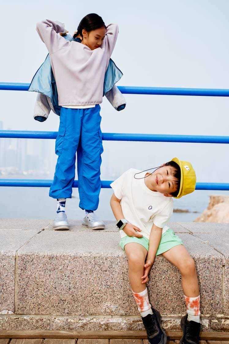 Editorial children clothing lookbook with kids in colorful streetwear at waterfront by Una Zhu